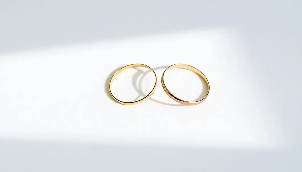 Minimalist matching gold bands symbolizing unity.